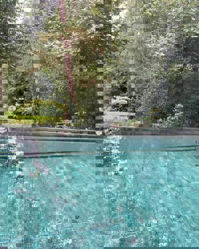Outdoor Swimming Pool with a River View